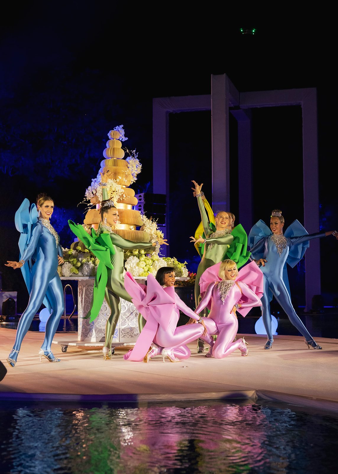Dancers in sculpted bow costumes