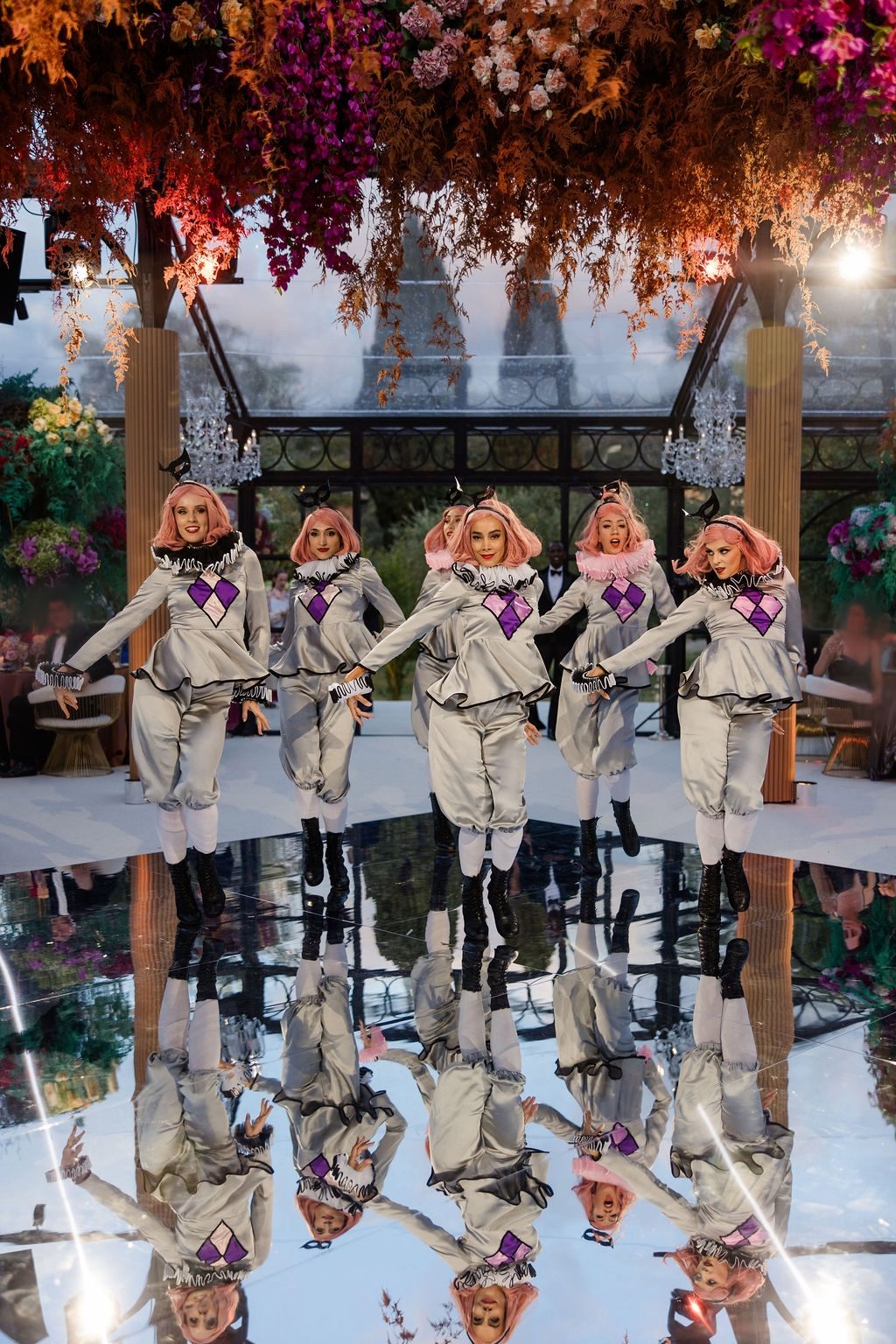 Pierrot dancers on a mirror floor